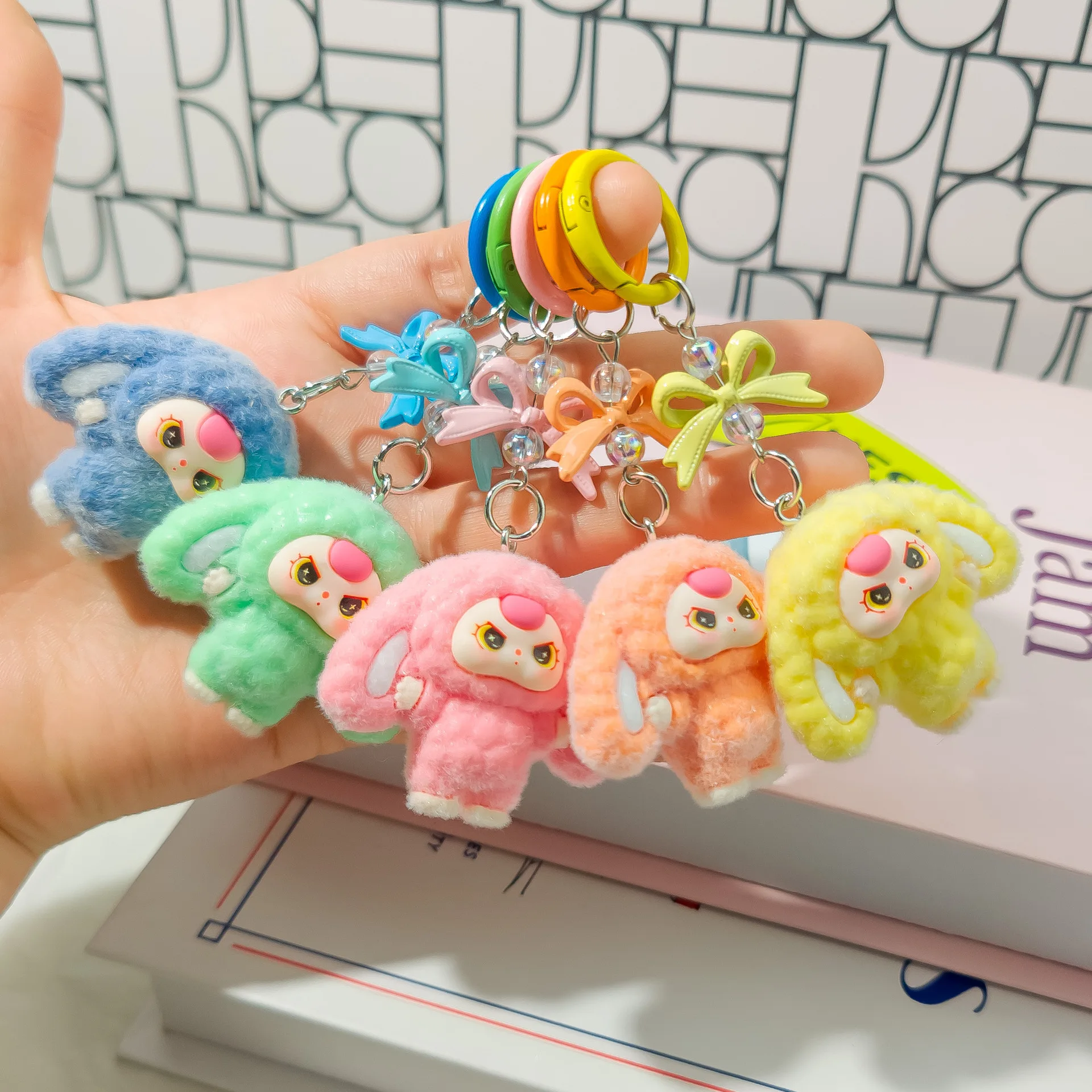 

A three-dimensional cartoon keychain doll of a three-year-old kid with big ears