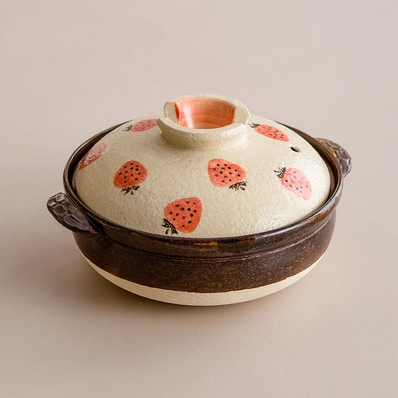 

Cute pink strawberries, earthen pot Japanese style, home cooking rice, soup stew casserole
