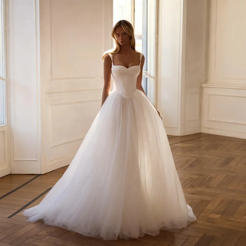 

Custom-Made Bridal Gown: Sweetheart Neckline, Spaghetti Straps, A-Line Paneling, Back Tie-Up Design, and Floor-Length Train
