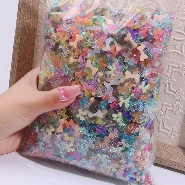 500-600 sztuk Mix kształt kokardki ozdoby do paznokci 50 g/worek Aurora wstążka żywica Bowknot 3D Rhinestone DIY koreańskie akcesoria do Manicure