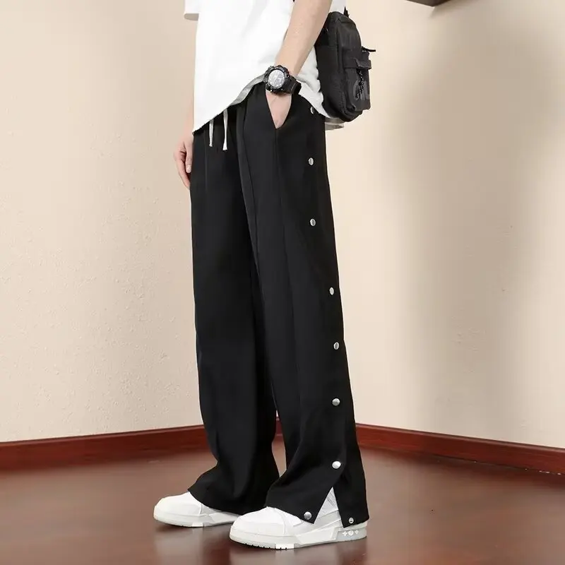 high street black casual pants for men and women with American design sense, breasted sports pants, loose straight leg wide leg