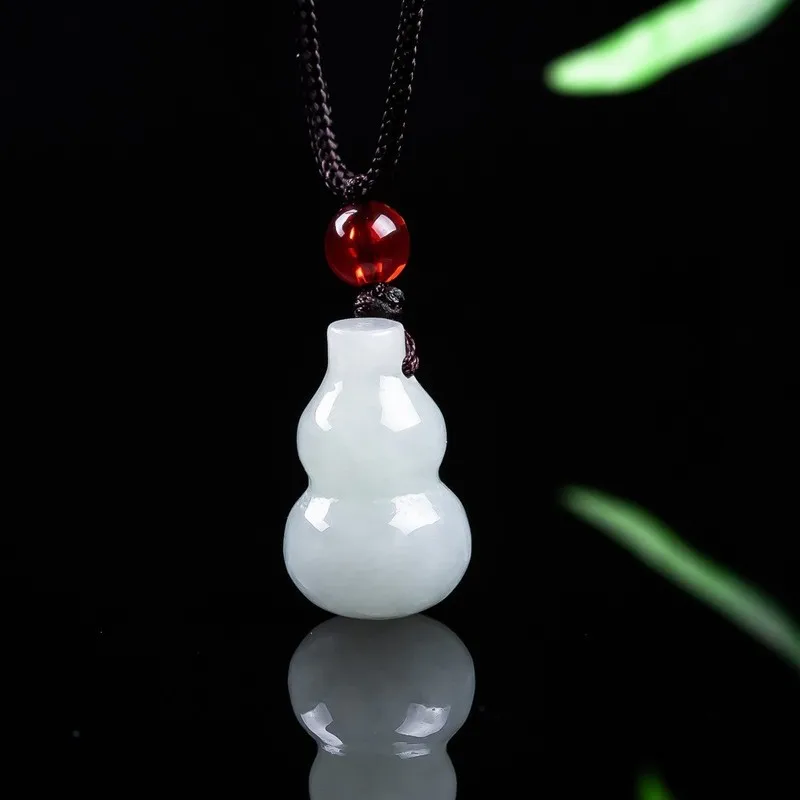 Soft translucent jadeite small gourd pendant with a smooth, pattern-free design, symbolizing both fortune and prosperity, si