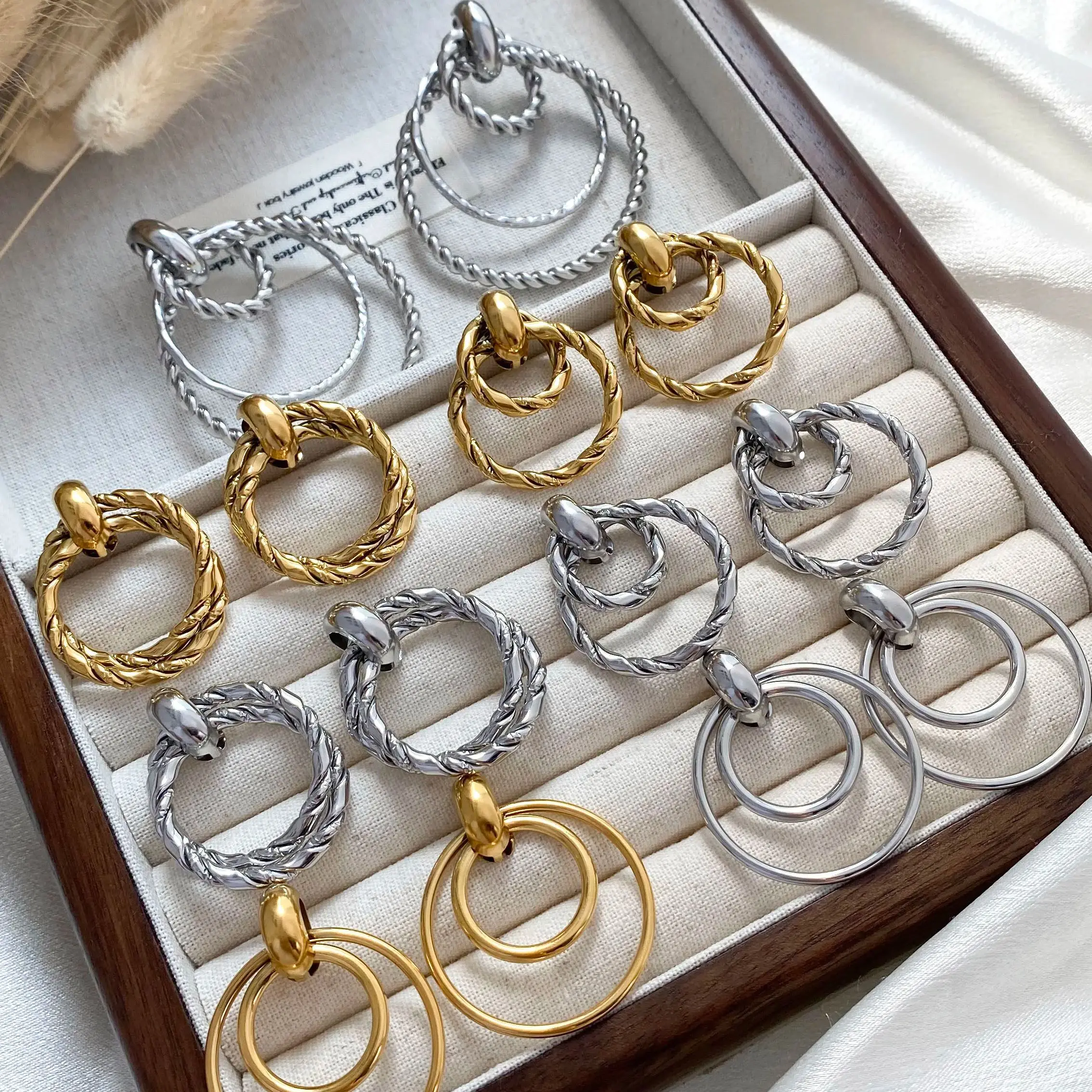 

CARLIDANA New Arrival Fashion Jewelry Stainless Steel Cool Fashion Double Round Fried Dough Twists Iron Geometric Drop Earrings