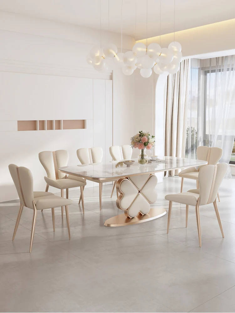 Bright slate dining table modern simple light luxury cream wind household small four-leaf clover rectangular dining table chair.