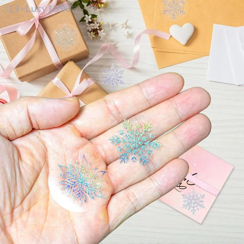 【CCA13】500枚/ロール 透明雪の結晶ステッカー クリスマスタグステッカー 子供用ギフト ベーキングパッケージ 封筒デコレーション
