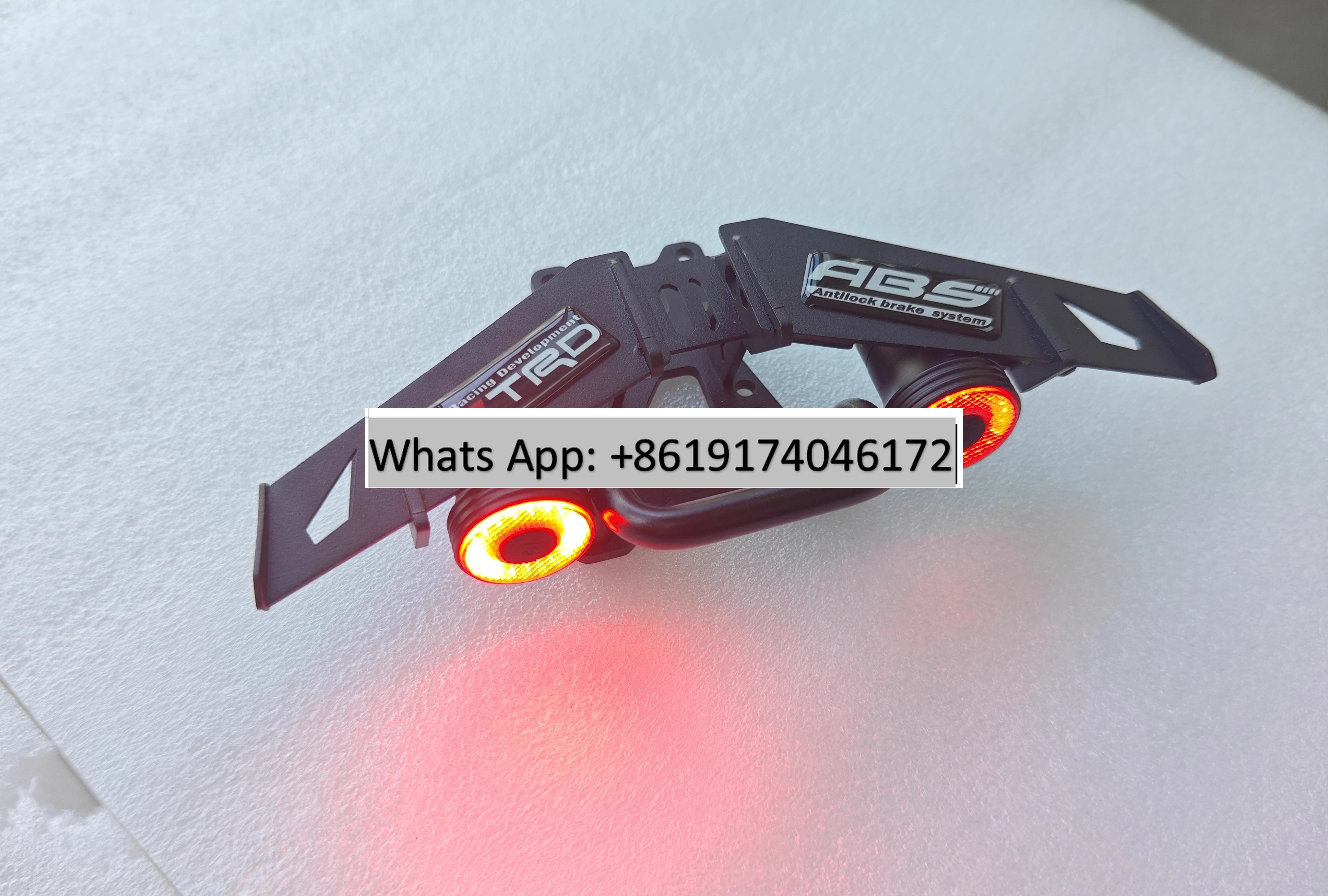 

Electric skateboard induction tail brake light