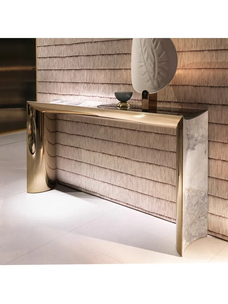 The entrance table is very narrow against the wall, with modern stainless steel partitions behind it.