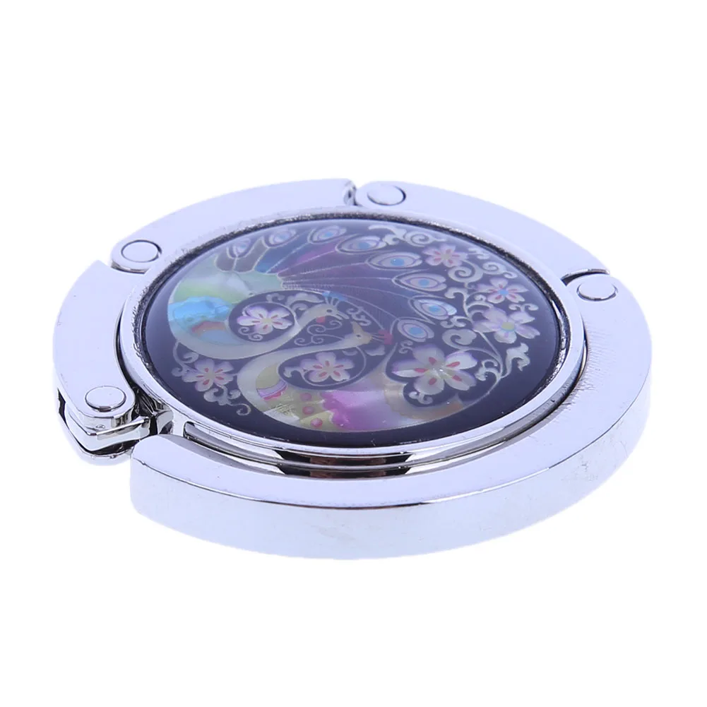 شماعة حقيبة يد قابلة للطي بخطاف محفظة الطاووس لتخزين حقائب اليد على الطاولة