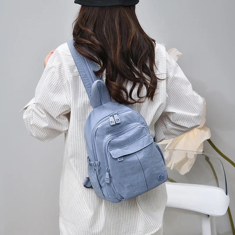 Women's small backpack, convertible from shoulder bag to backpack, suitable for outdoor and casual use, lightweight Oxford cloth