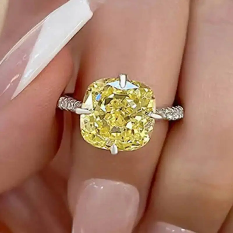Huitan Ring in einfacher Ausführung, silberfarben, für Damen, mit leuchtend gelbem Zirkonia, vielseitiges Party-Accessoire, trendiger Schmuck