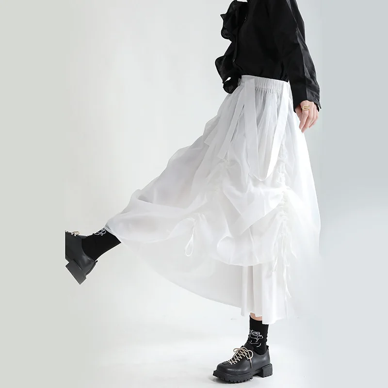 Design sense black suspender skirt 2024 spring clothes high waist slimming mid-length drawstring half skirt female