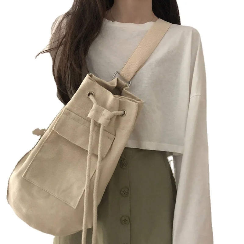 Large capacity bucket bag Korean version Ins early autumn pocket canvas drawstring diagonal shoulder bag for men and women