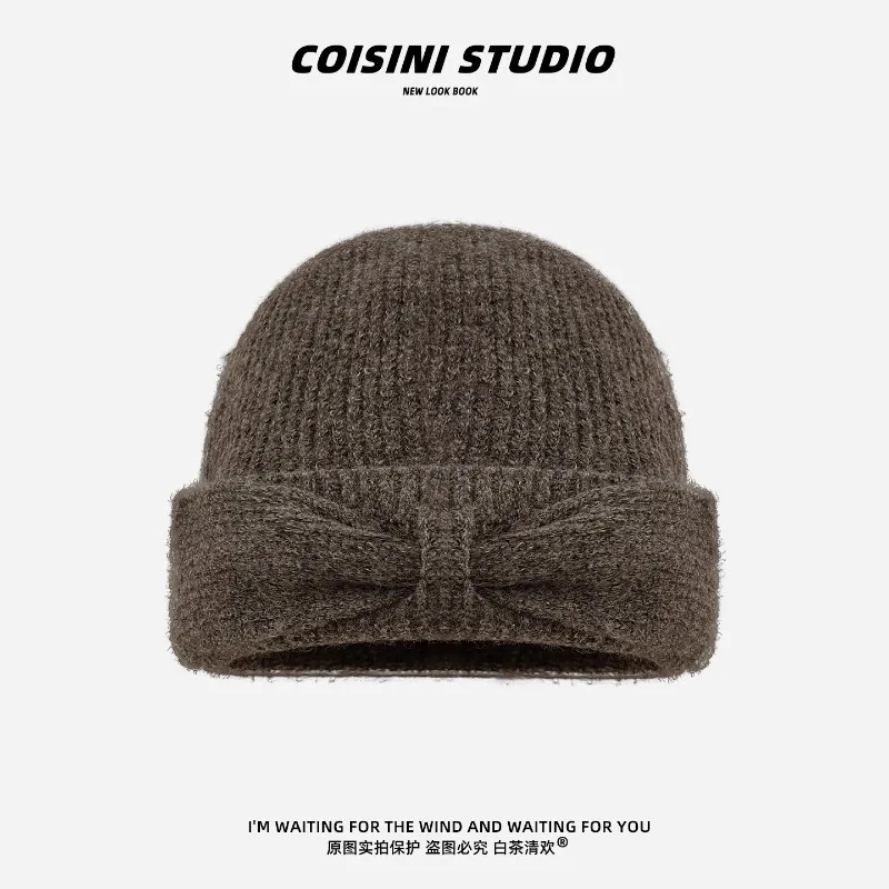 Koreanischer Stil Herbst- und Winter-Strickmütze mit einfacher Schleife für Damen, warme Ohrenschutz-Beanie-Mütze für Herbst und Winter. – Detail 7