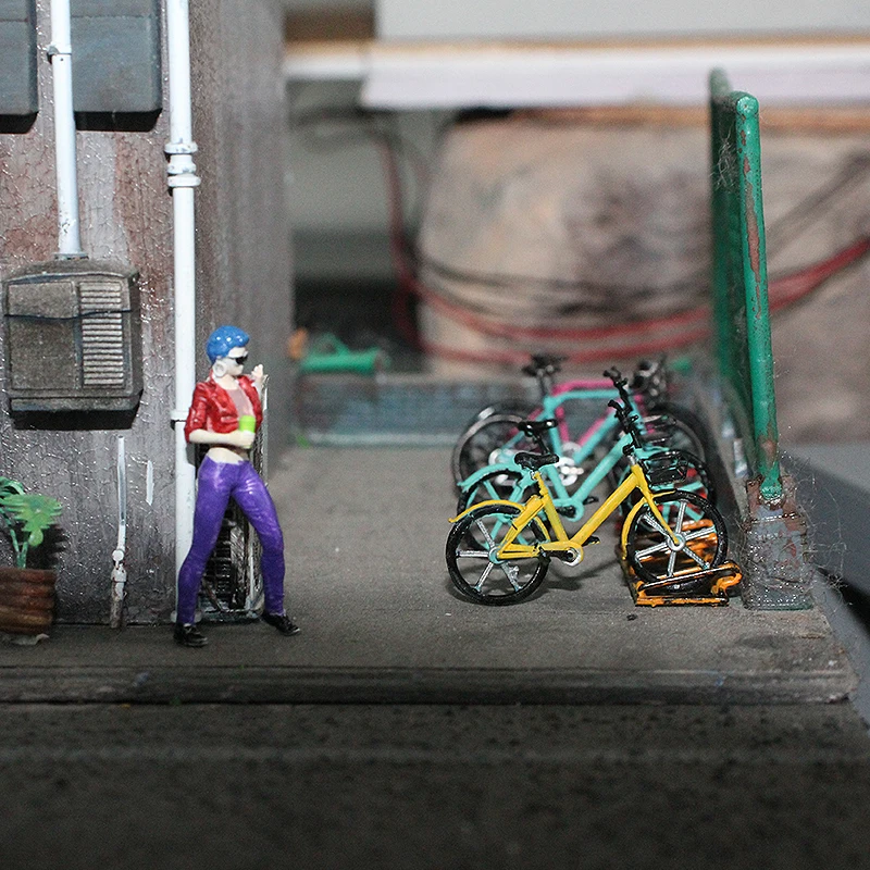 Model roweru w skali 1:64, rower szosowy, model roweru publicznego, model stojaka na rowery.