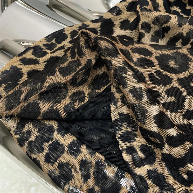 Abito da donna 2026 Primavera nuovo mini abito elastico Stampa leopardata girocollo abito corto Abiti da festa con abito avvolgente sui fianchi irregolari