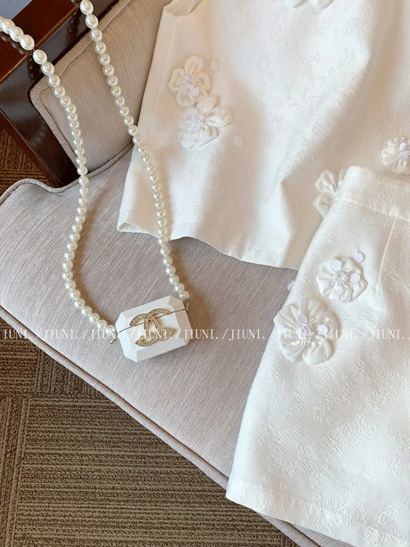 フランスの新しい小さな香りの良いツーピースセット レディース サマーファッション 3Dフラワー ノースリーブベストトップ + ミニスカート セレブリティパーティースーツ