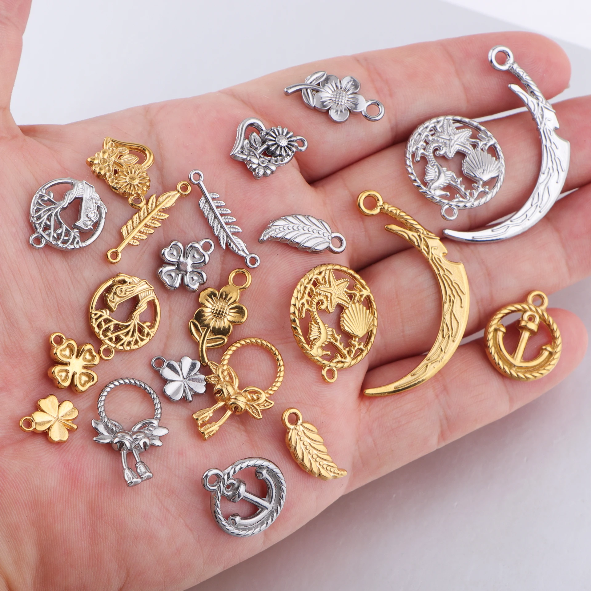 

10pcs/lot Stainless Steel Flower Leaf Bell Anchor Tree of Life Feather Crescent Moon Charms Pendant for DIY Jewelry Making