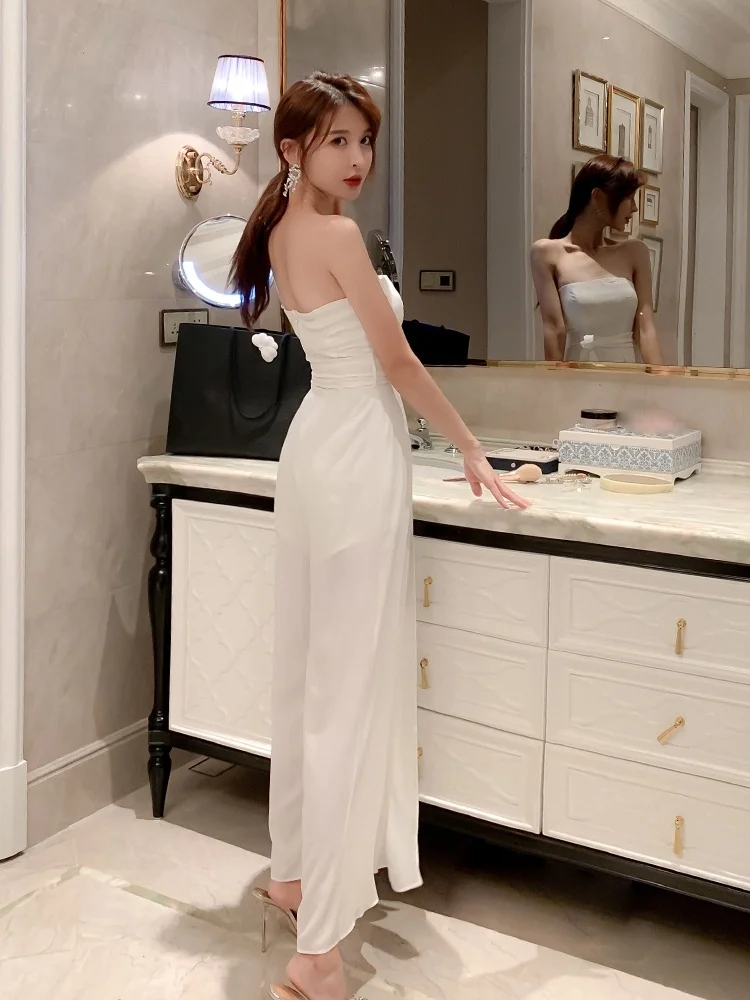 Seksowny biały kombinezon na ramiączkach 2025 Nowy Ele Lady High-End Super Fairy Spodnie z szerokimi nogawkami z rozcięciem, wysoki stan, długie spodnie, model wyszczuplający