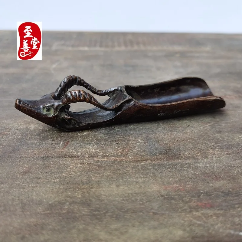Antique-style copper alloy decorative piece for living room, featuring a sheep head design and a tea scoop, with an aged patina1