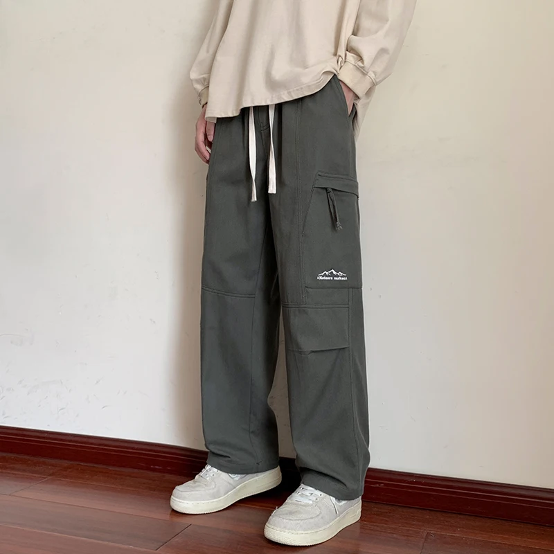 

Men's Oversized Cargo Pants Loose Cotton Tactical Military Pants with Pockets Drawstring Hiking Baggy Trousers