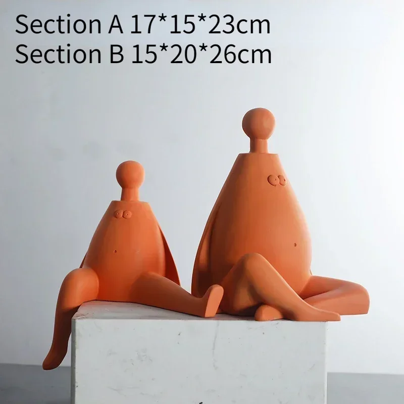 

Modern simple orange person ornaments Hotel model room Home living room Desktop resin craft decorations