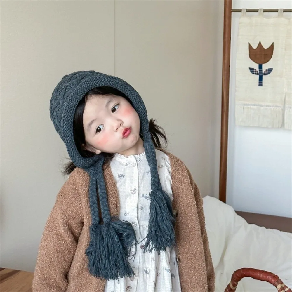 

Korean Autumn Winter Baby Crochet Hat Soft Warm Pom-pom Hand Knitted Cap Outdoor Tassel Pigtail Ear Protection Cap Toddler