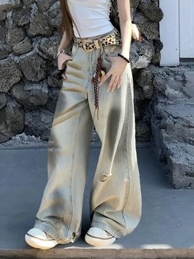 Amerikaanse stijl retro noodlijdende gele modder vuile geverfde jeans dames lente herfst 2025, ontwerpgevoel gescheurde broek met wijde pijpen
