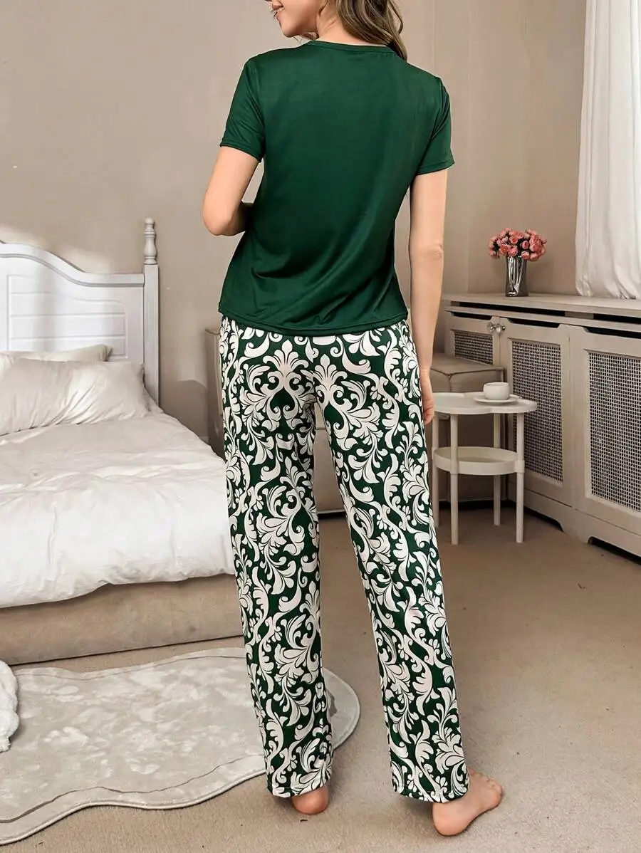 

Women’s 2-Piece Sleepwear: Solid Dark Green Short Sleeve Crew Neck Top With White Baroque Vine Motif Loose Wide Leg Pants