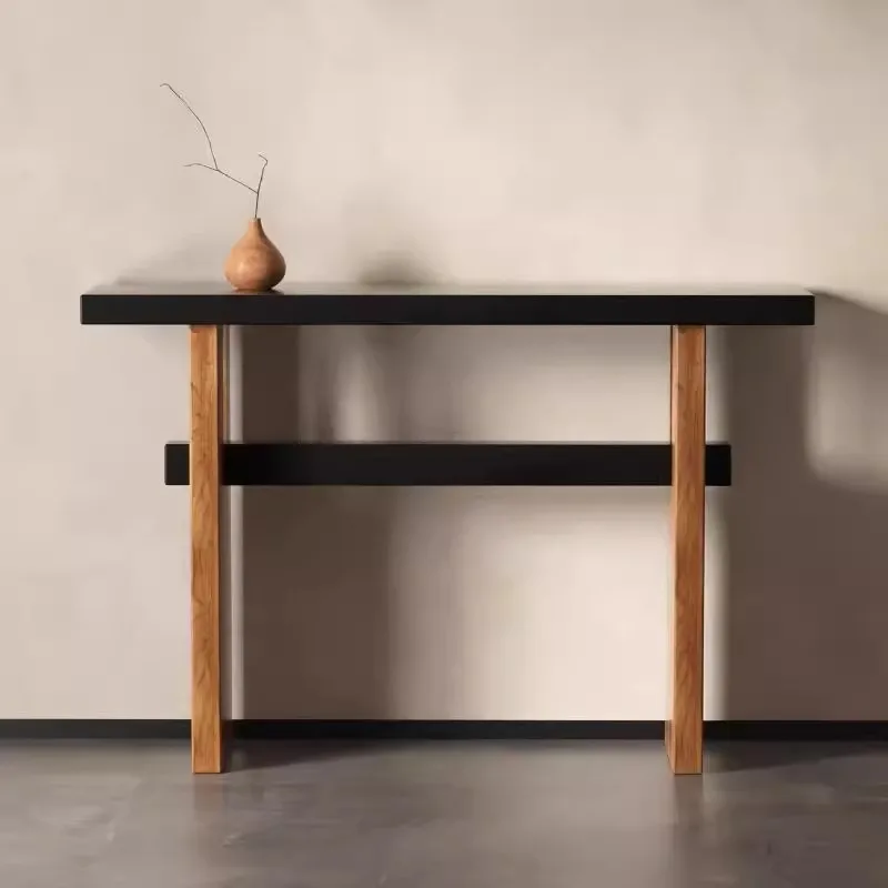 Medieval style solid wood entrance table against the wall when entering the house
