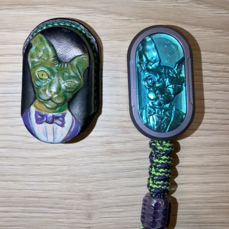 

Used EDC TK Titanium Cat with Purple Green Woven Hanging Rope fidget slider decompression toy