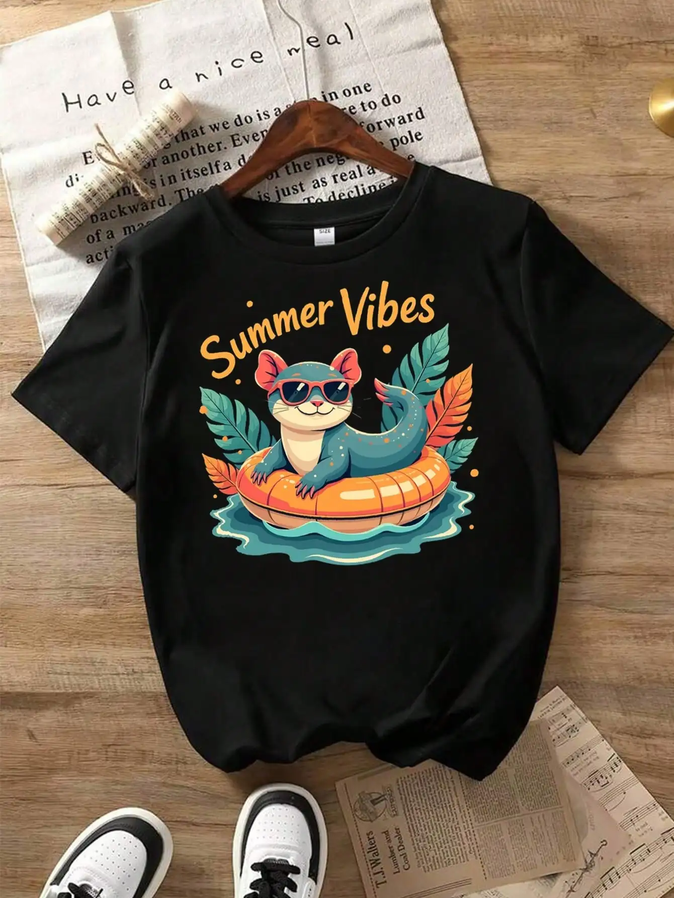 

Cat Summer Vibes Cotton T-Shirt, Black Tee With Cat, Leaves, And Pool Float, Summer Vibes Summer Tops