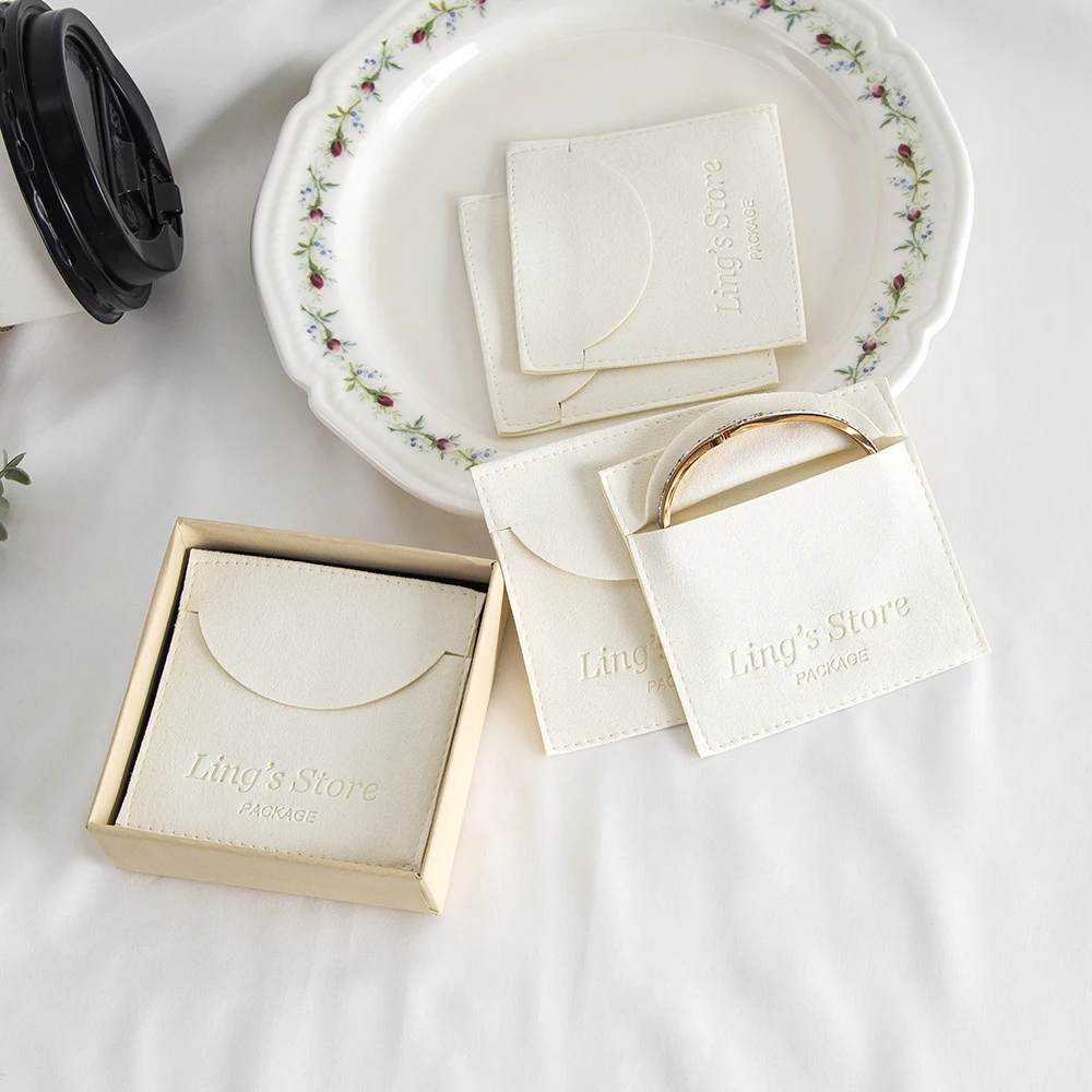 

100Pcs Custom Logo Ivory Microfiber Jewelry Velvet Pouch Envelope Gift Packaging Bag Ring Earring Necklace Bracelet Pendant Sack
