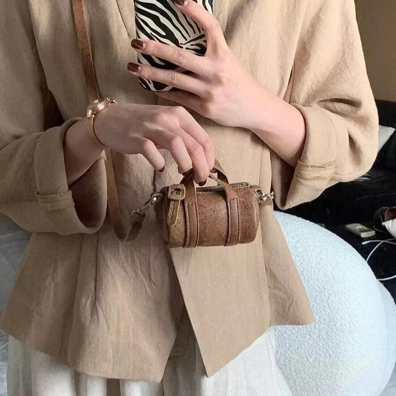 

Retro brown 2025 autumn new mini exquisite niche hanging neck high-end cylindrical shoulder crossbody mini bag