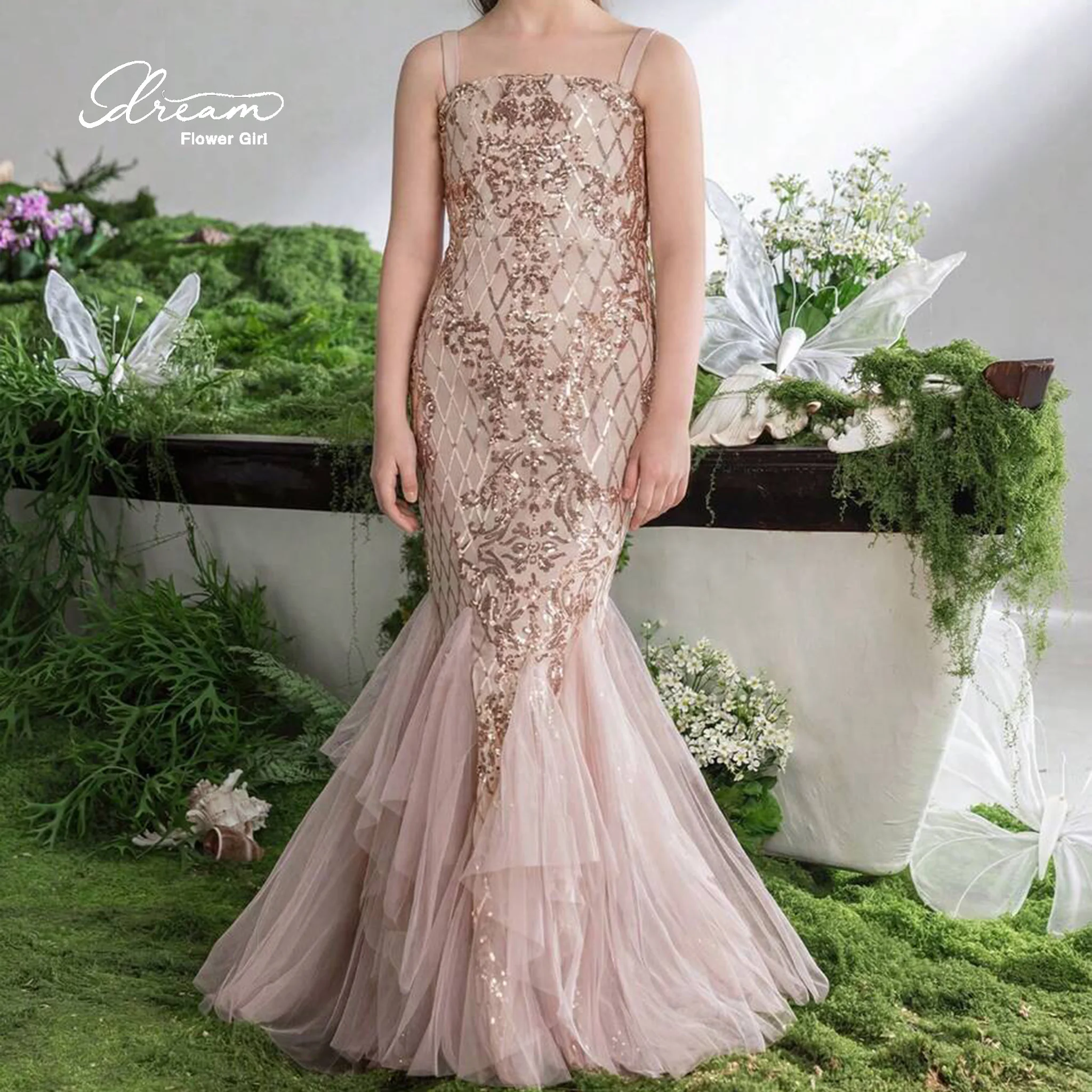 Champagne-colored strapless mermaid-style formal gown for girls featuring a bodice with printed embroidery and a tulle skirt