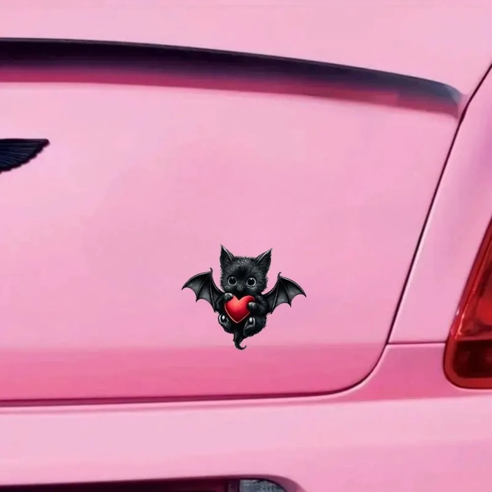 Car Vinyl Decal Adorable Black Fluffy Kitten like Creature with Bat Wings Clutches Red Heart Solid Background Waterproof