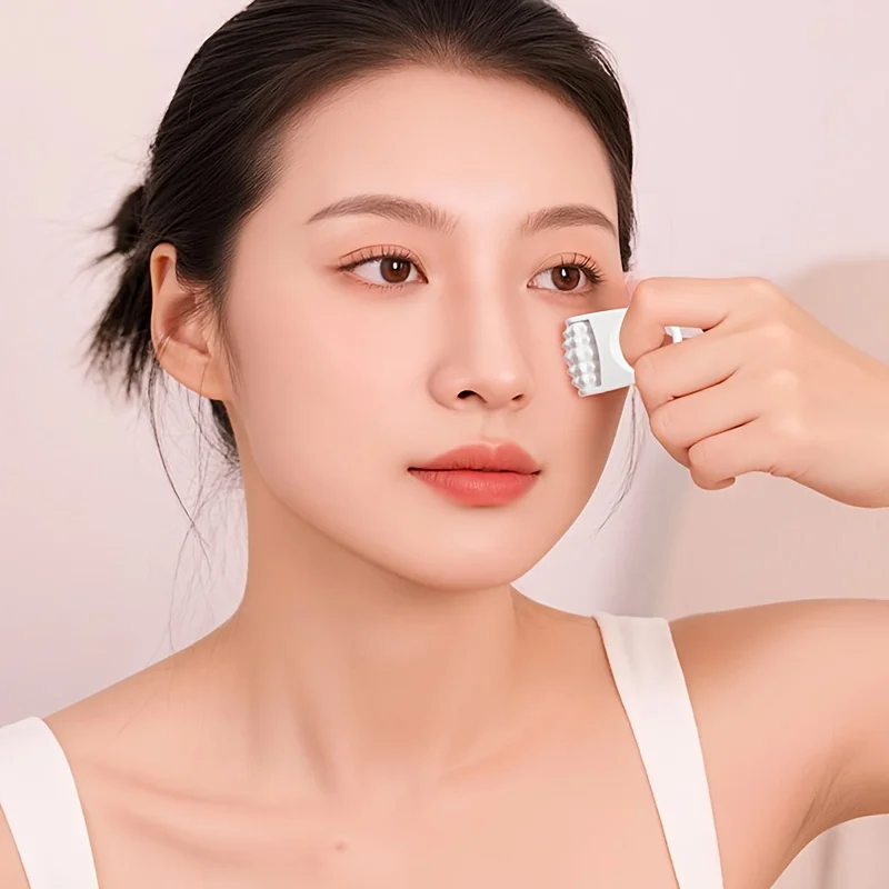 

Portable Mini Handheld Facial Eye and Neck Massager with Rolling Balls Sleek Durable Plastic Manual Design for Skincare Routine