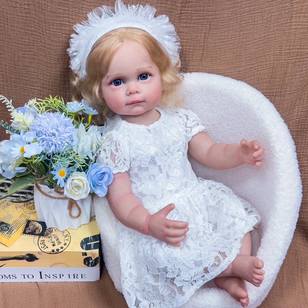 ตุ๊กตาไวนิลรีบอร์นขนาด 22 นิ้ว - ตุ๊กตาหายากสำหรับนักสะสม ผมบลอนด์ ตาสีฟ้า ชุดเจ้าหญิงสีขาว ตุ๊กตาเหมือนจริงที่สามารถจัดท่าทางได้ บรรจุในกล่องของขวัญ