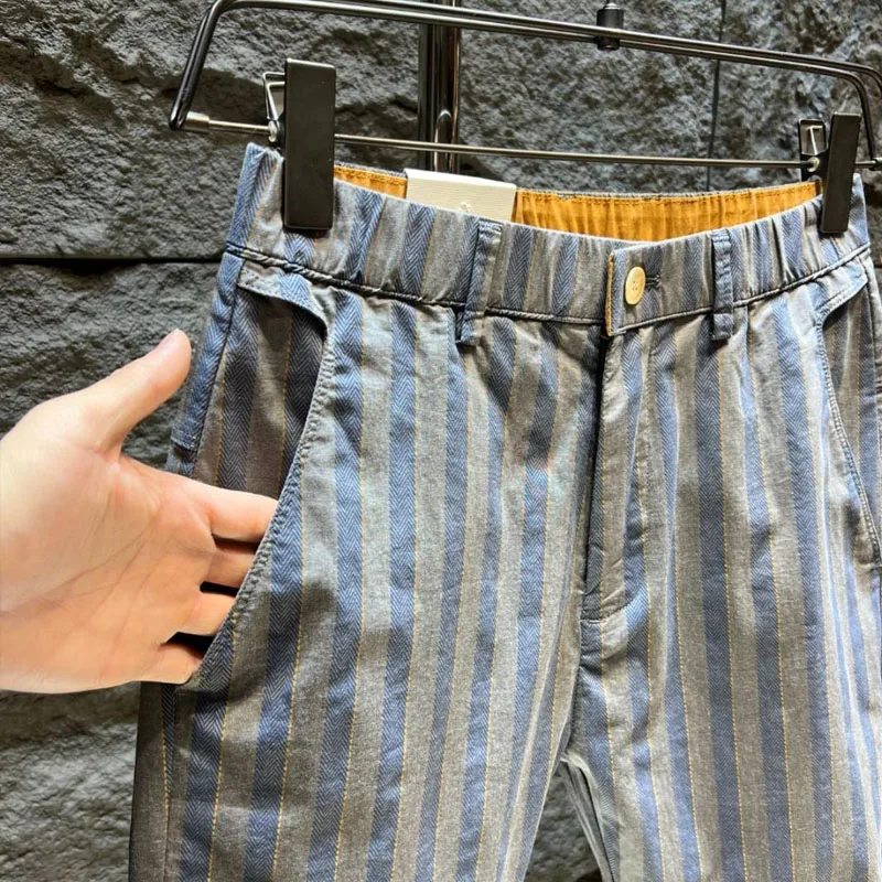 Calça com harém na cintura elástica masculina, botão de rua alto, estilo fino, calça com todos os fósforos, nova, primavera, verão