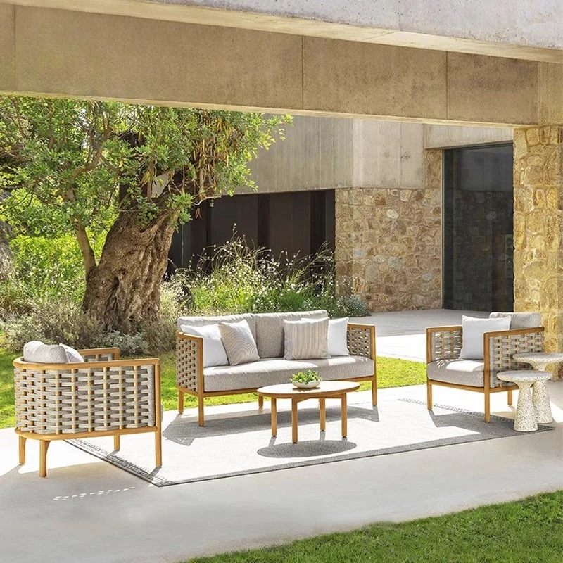 Villa courtyard teak sofa chair leisure garden terrace imitation wood grain rattan sofa round table hotel bed and breakfast