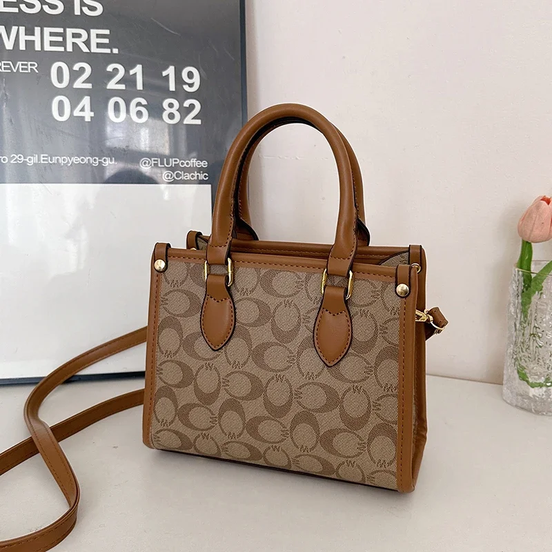 

Luxury Retro Messenger Bag For Ladies As A Shoulder And Crossbody Bag With Minimalist Look And Solid Color As A Chic Diaper Bag