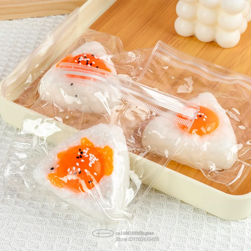 لعبة إسفنجية لصفار البيض - كرة ضغط من السيليكون الآمنة للطعام، لعبة كرة الأرز كاواي للقلق والتركيز