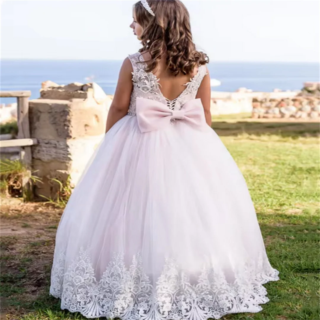 Abiti da ragazza di fiori con applicazioni in tulle rosa chiaro con fiocco senza maniche per abiti da principessa per banchetti, feste di compleanno, matrimoni