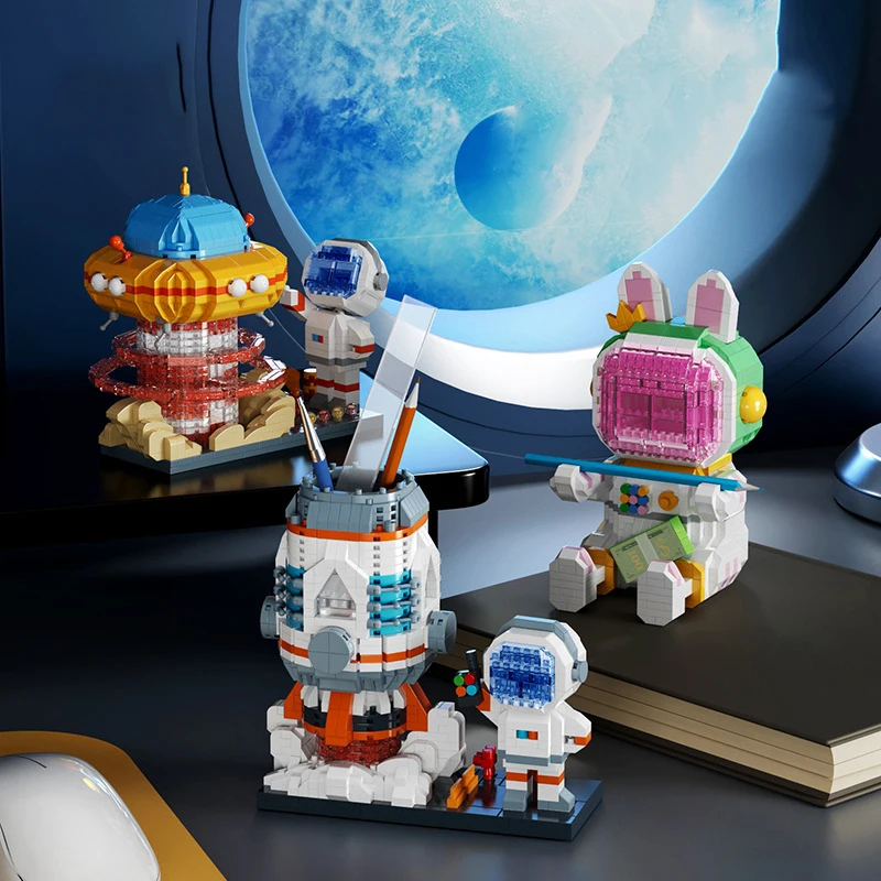 

Микро-конструктор с мультяшным кроликом астронавтом, контейнер для ручек с космической ракеткой, держатель для телефона, мини-фигурки из кирпича, игрушки для детей, подарок на Рождество