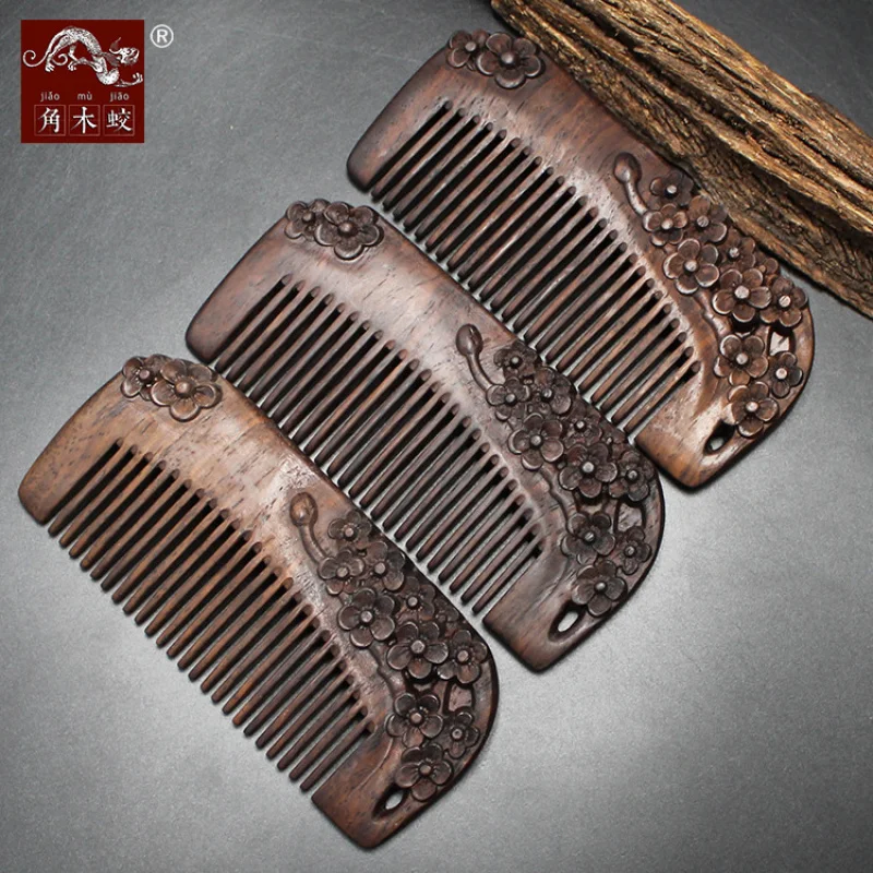 Solid wood carved plum blossom comb made from hornwood, ebony, and black sandalwood