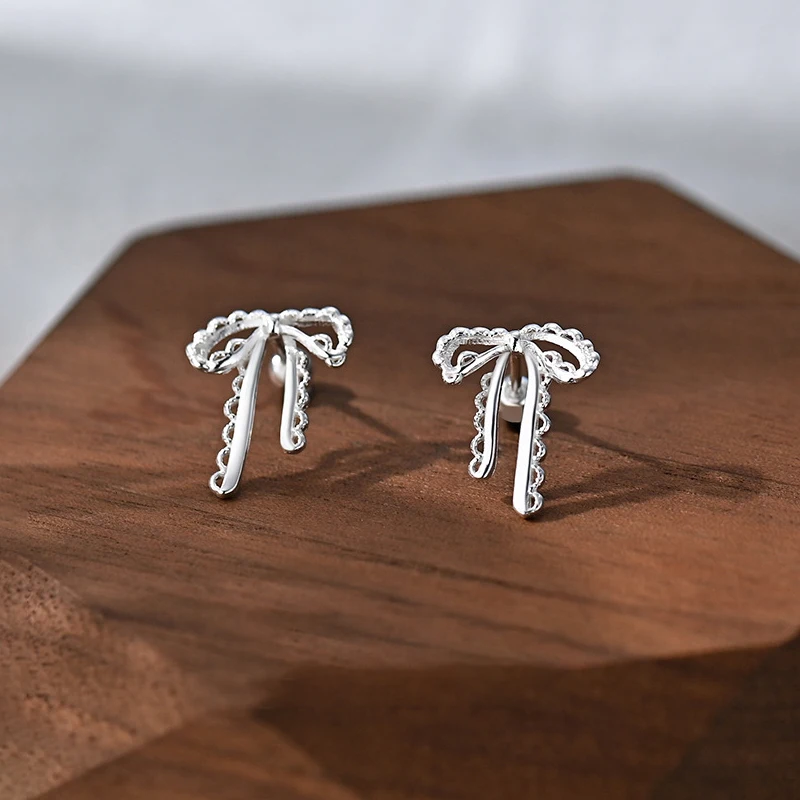 

Real 925 Sterling Silver Hollow Ribbon Bow Mini Stud Earrings for Charm Women Cute Fine Jewelry Sweet Geometric Accessories