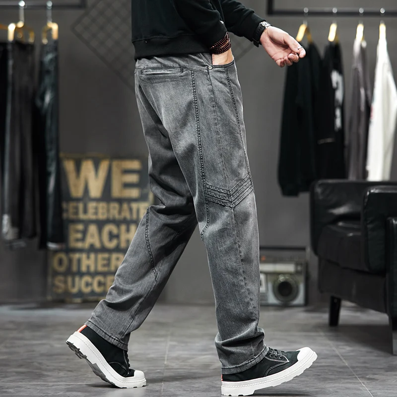 

ay Large Size Men's Jeans Loose Slim Fit Elastic Splicing Long Pants Faionable Cotton Denim mid Waist Zipper Closure