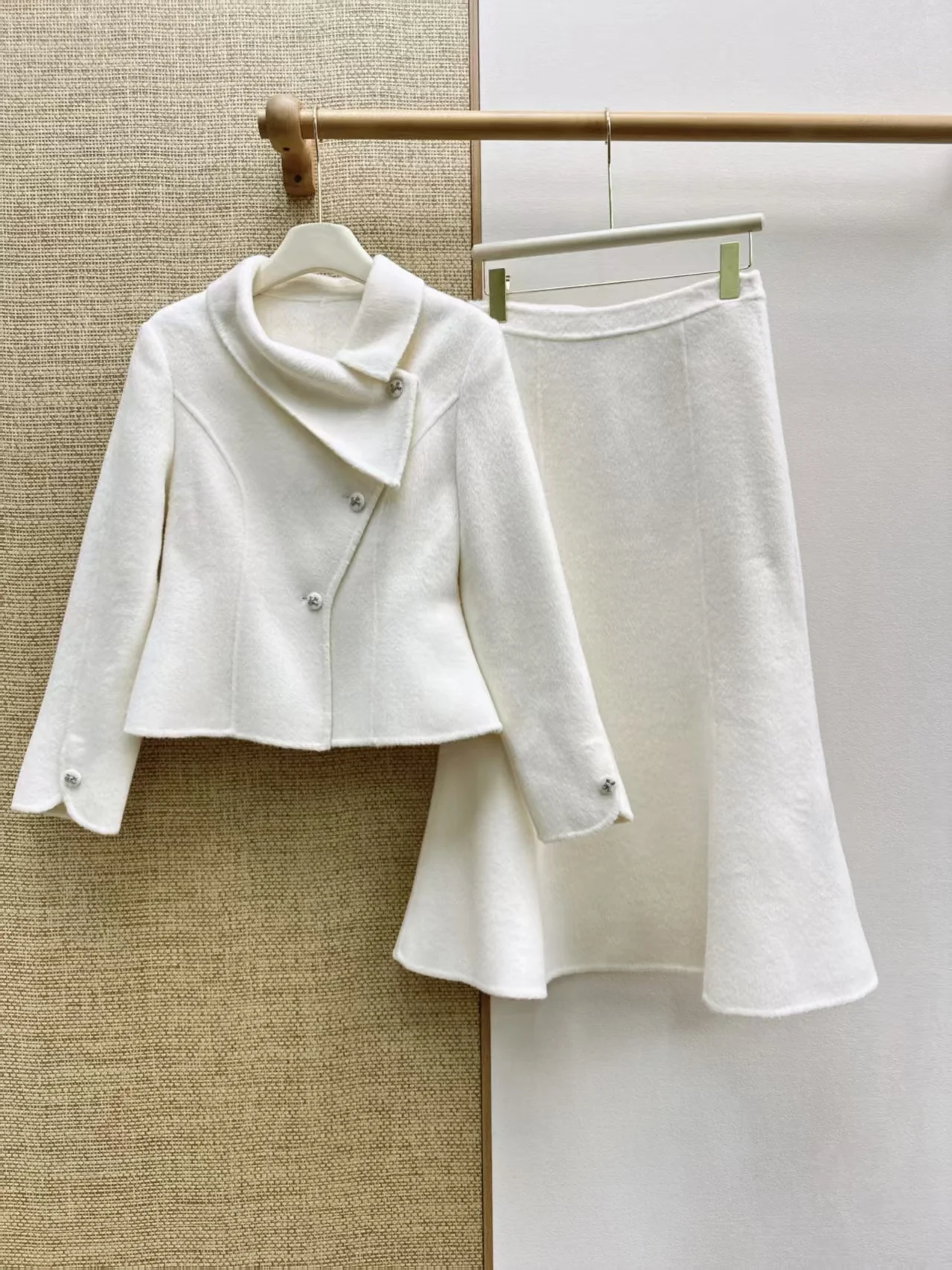 Autumn and winter new double-sided woolen irregular slanted collar pearl button short jacket fish tail skirt set