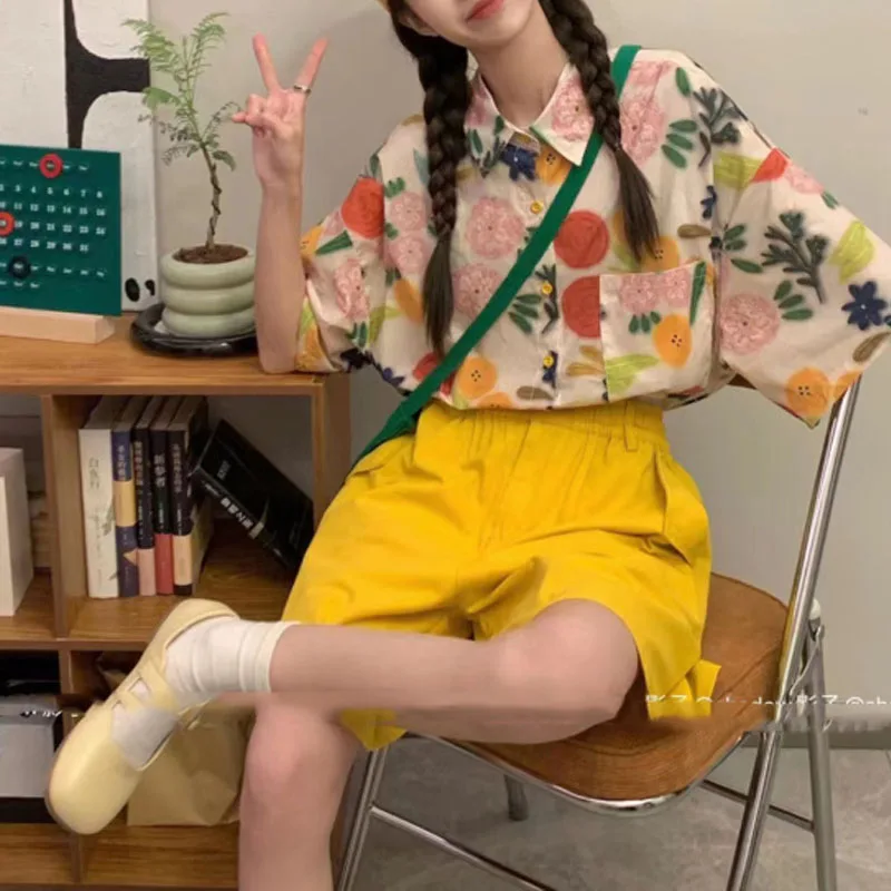 Camiseta de manga corta con bolsillos y botones para mujer, camisa holgada informal con estampado sencillo, estilo de vacaciones, novedad de verano
