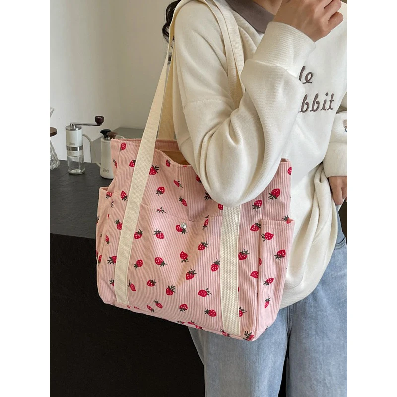 

2025 New Pink Fresh and sweet girl handbag corduroy strawberry printed shoulder bag casual shopping commuting women's armpit bag