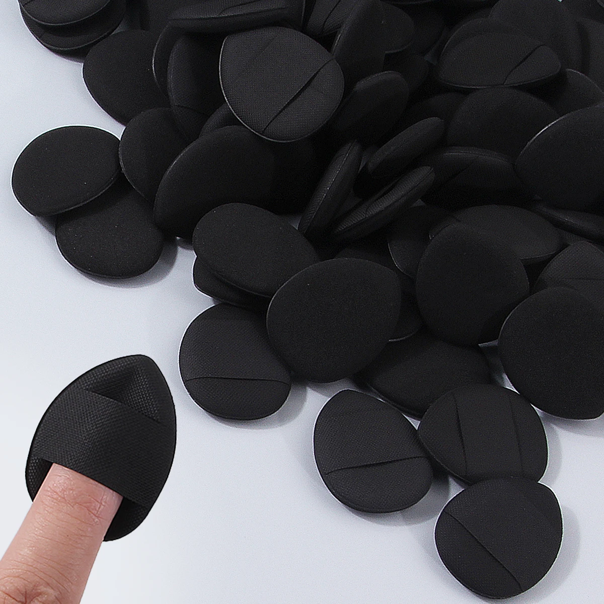 100PCS Super affordable and portable makeup thumb set, teardrop-shaped dry and wet dual-purpose non-stick mini powder puff